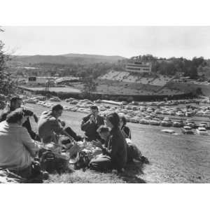  Picnicking Fans Sitting on a Hill Above Arkansas Stadium 