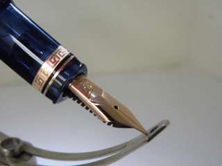 The 18k gold nib is engraved with an image of the pens triangular 