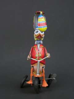Vintage Tin Wind Up Duck on Bicycle Twirling Hat Made in Western 