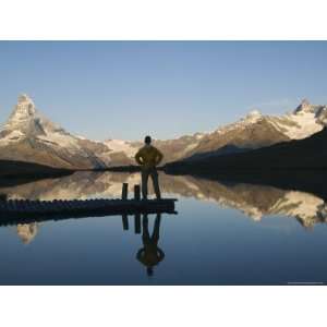  Hiker Contemplating the Reflection of the Matterhorn 