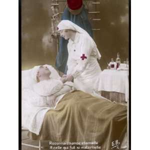 Nurse with a Red Cross on Her Uniform Cares for a Wounded French 