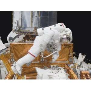 Astronaut Working on the Hubble Space Telescope During a Spacewalk 