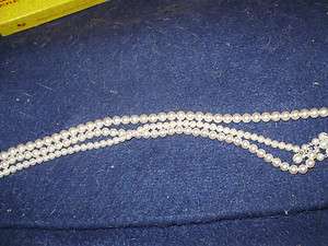 Ladys old necklace. Three strands of pearls. Old necklace   neck 