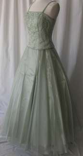   ball gown dress the color is sage the dress is made from satin bodice