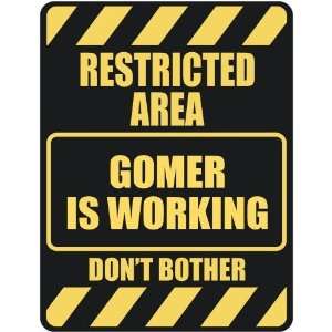   RESTRICTED AREA GOMER IS WORKING  PARKING SIGN