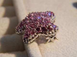   pin with pink sapphire 5 4 grams time period modern metal and weight