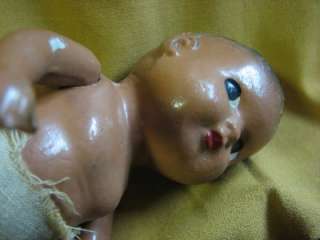 ANTIQUE BLACK COMPOSITION DOLL WITH DIAPER  