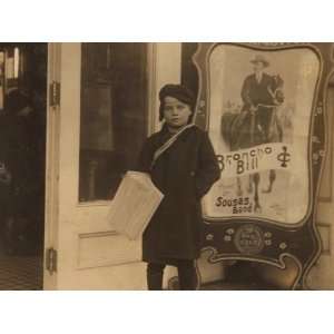  1910 child labor photo Newsie, ten years old. Going into a 