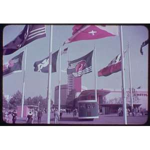  Photo Worlds Fair. Chrysler Motors Building, viewed through flags 