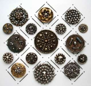  antique metal buttons featuring a variety of designs with cut steels 