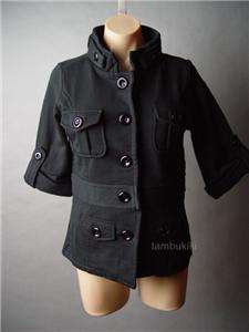 Military inspired black coat. A stand collar, cargo style pockets and 