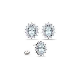  0.56 Ct Diamond & 1.62 Ct Sky Blue Topaz Earrings in 18K 