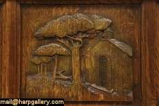 An oak trunk, window bench or blanket chest has hand carved scenes 