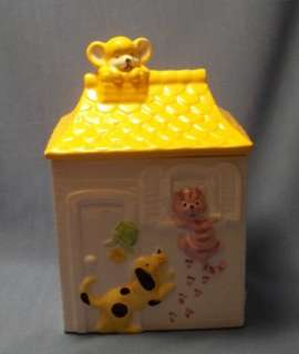   CAT, AND MOUSE ON A HOUSE COOKIE JAR. YELLOW AND PINK COLORS.  
