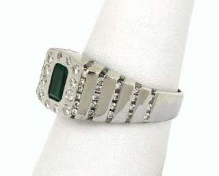 this is a trendy 14k gold diamonds and emerald solitaire band