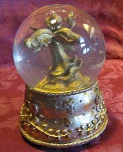 Golden Angel Musical Snow Globe plays Santa Claus Is Co  