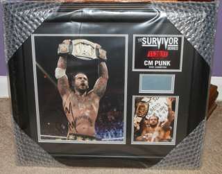 WWE CM Punk Autographed Survivor Series 2011 Plaque, Includes Piece of 
