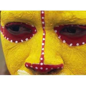 Close up of Facial Decoration in Yellow, Red and White Make Up, Papua 