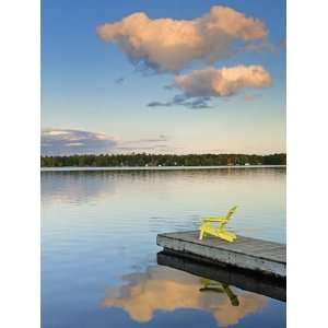  Clouds reflected in Silent Lake with Muskoka chair on dock 