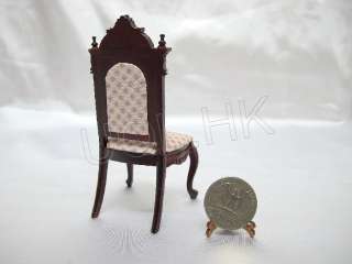 Mahogany carved wood frame with soft pint gird pattern seat.
